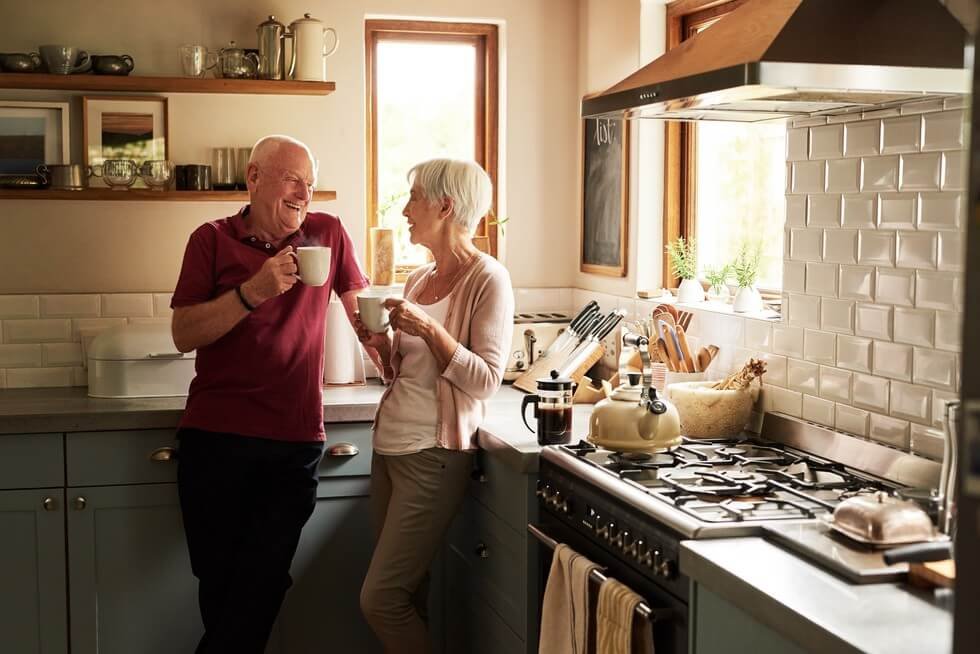 Old couple having tea in the kitchen of a Liverpool house for sale