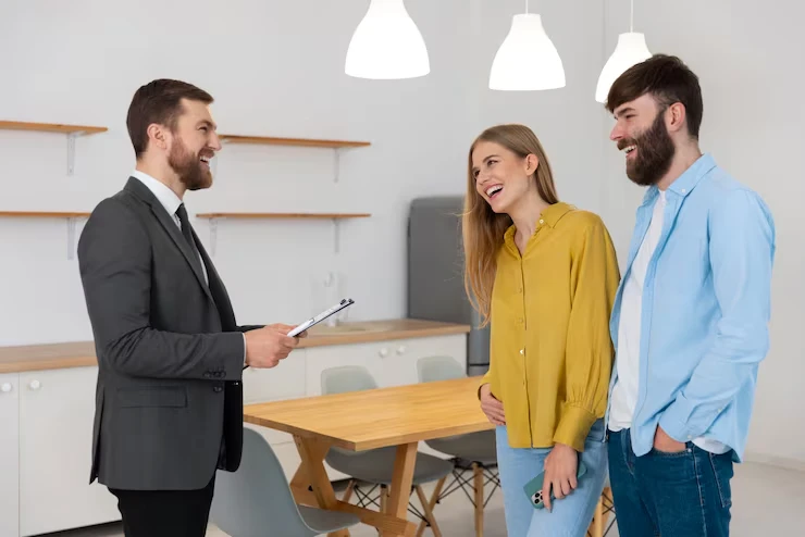 Property deal sourcing consultation with happy couple finding perfect investment deals in Leeds