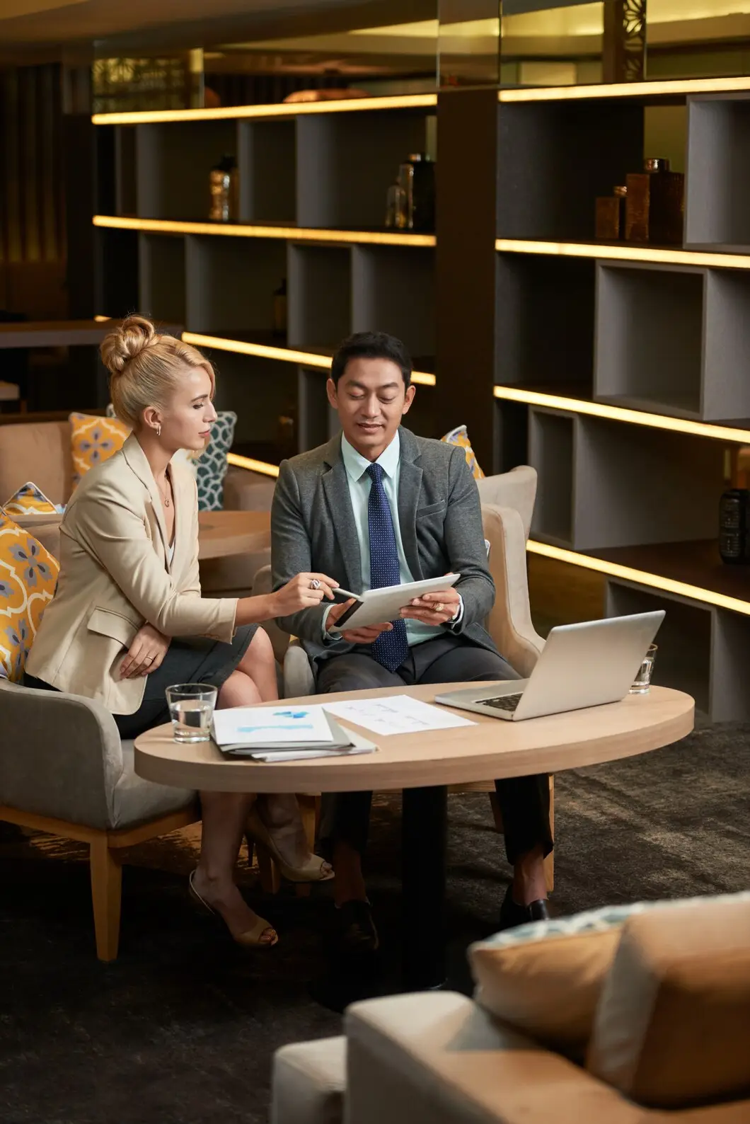 Exclusive property care and concierge assistance services with luxury client consultation in upscale lounge