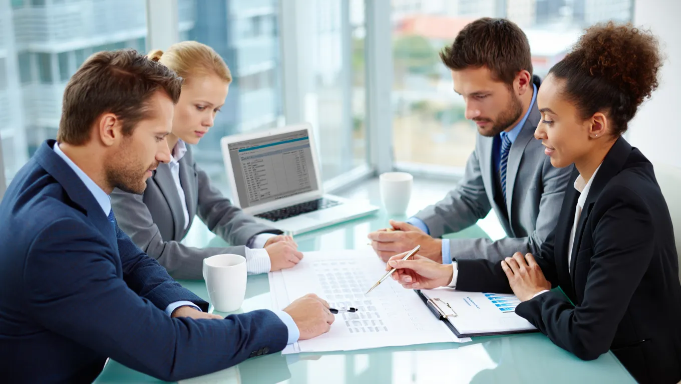 Luxury property sourcing consultants analyzing high-end Glasgow real estate market data