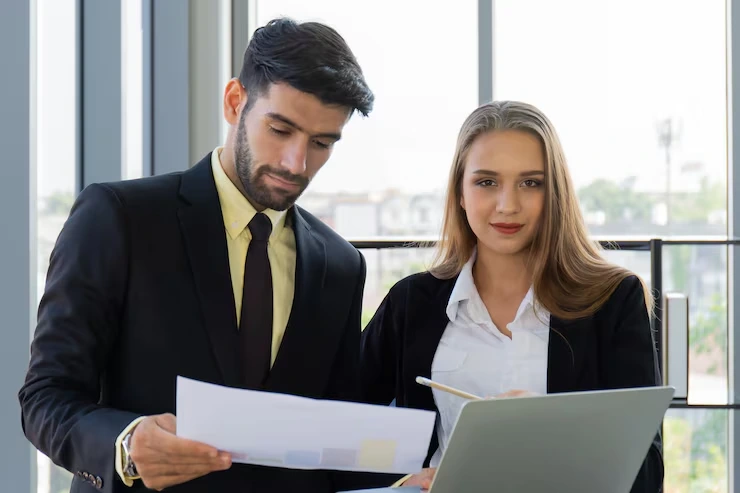 Real estate legal advisor reviewing compliance documents and structuring property transaction file