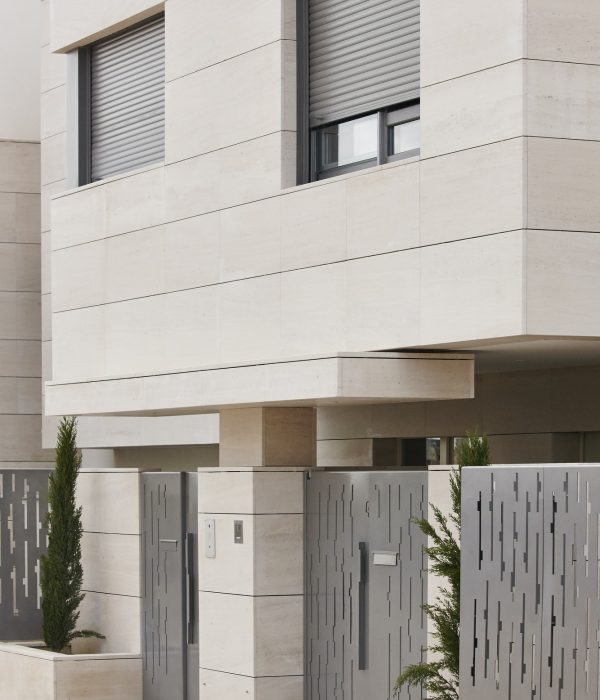 Modern residential building entrance. Estate property. Marble stone. Construction. Vertical